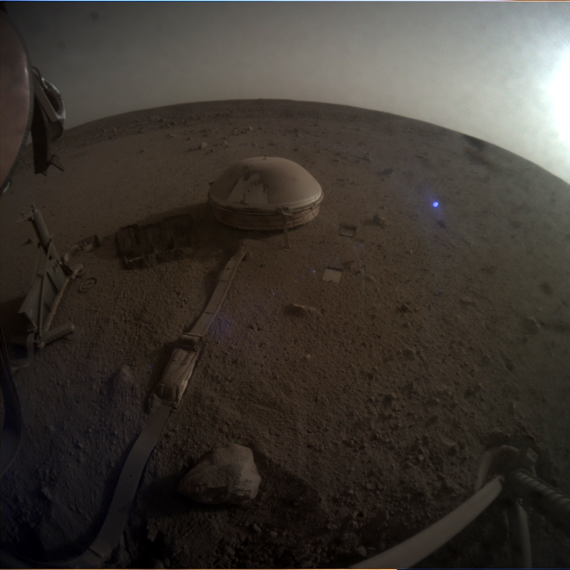 InSight's seismometer in a fisheye photo of Mars.