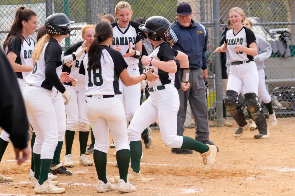 LeeAnn Downey is surrounded by her Ramapo teammates after hitting a home-run. The homer put Ramapo ahead and ended up beating Ridgefield Park, 12-2. Tuesday, April 25, 2023