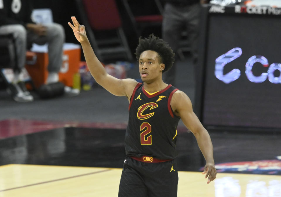 Collin Sexton celebrates a three