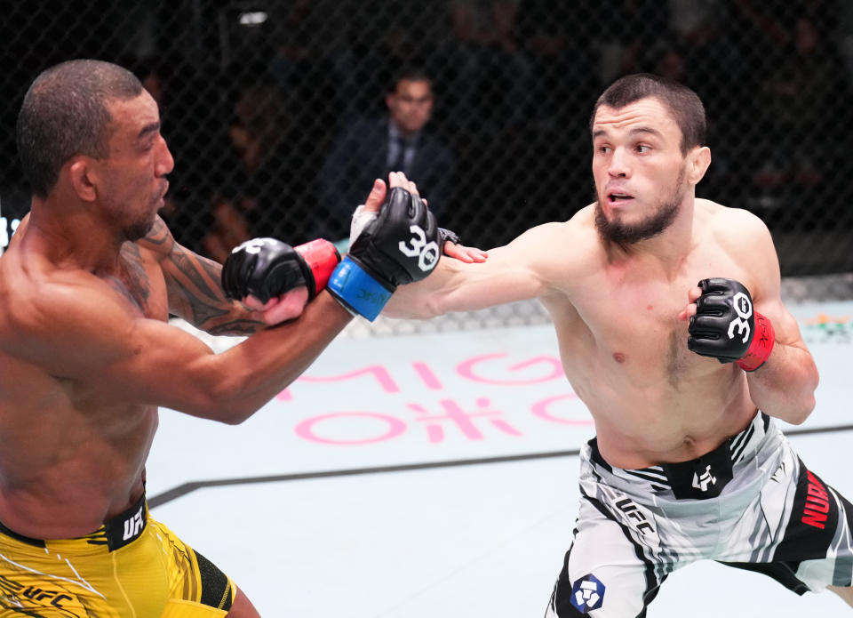 LAS VEGAS, NEVADA – JANUARY 14: (R-L) Umar Nurmagomedov of Russia punches Raoni Barcelos of <a class="link " href="https://sports.yahoo.com/soccer/teams/brazil/" data-i13n="sec:content-canvas;subsec:anchor_text;elm:context_link" data-ylk="slk:Brazil;sec:content-canvas;subsec:anchor_text;elm:context_link;itc:0">Brazil</a> in a bantamweight fight during the UFC Fight Night event at UFC APEX on January 14, 2023 in Las Vegas, Nevada. (Photo by Chris Unger/Zuffa LLC via Getty Images)