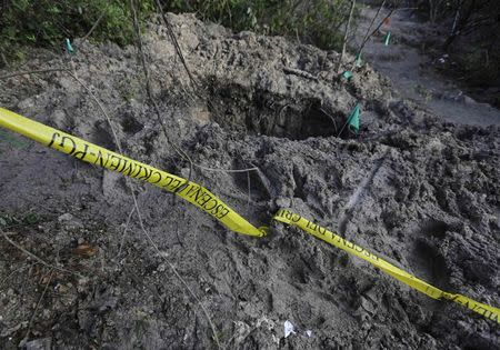 A clandestine grave is seen at Pueblo Viejo, in the outskirts of Iguala, southern Mexican state of Guerrero October 7, 2014. REUTERS/Henry Romero