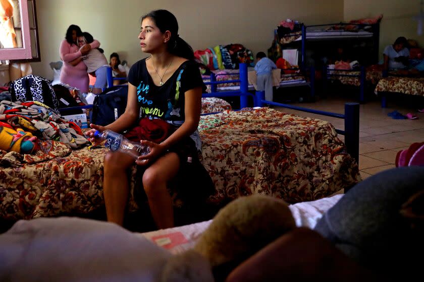 MEXICALI, BAJA CALIFORNIA - MAY 10: Norma Garcia Bonilla, 22, of Michoacan, Mexico, waits on asylum at Albergue Del Desierto on Wednesday, May 10, 2023 in Mexicali, Baja California. Title 42, a pandemic-era policy that allowed border agents to quickly turn back migrants, expires this week. Under a new rule, the U.S. on Thursday will begin denying asylum to migrants who show up at the U.S.-Mexico border without first applying online or seeking protection in a country they passed through. (Gary Coronado / Los Angeles Times)