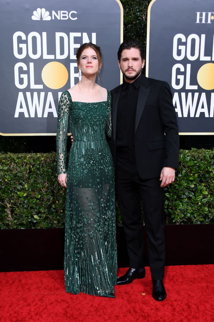 Kit Harington is wearing a black suit while Rose Leslie chose a sequinned gown by Elie Saab. <em>[Photo: Getty]</em>