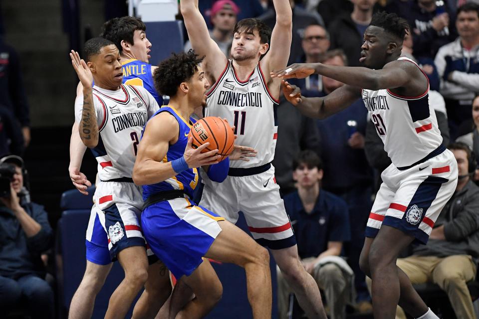 Colby Jones, here being pressured by the UConn defense, scored 20 points.