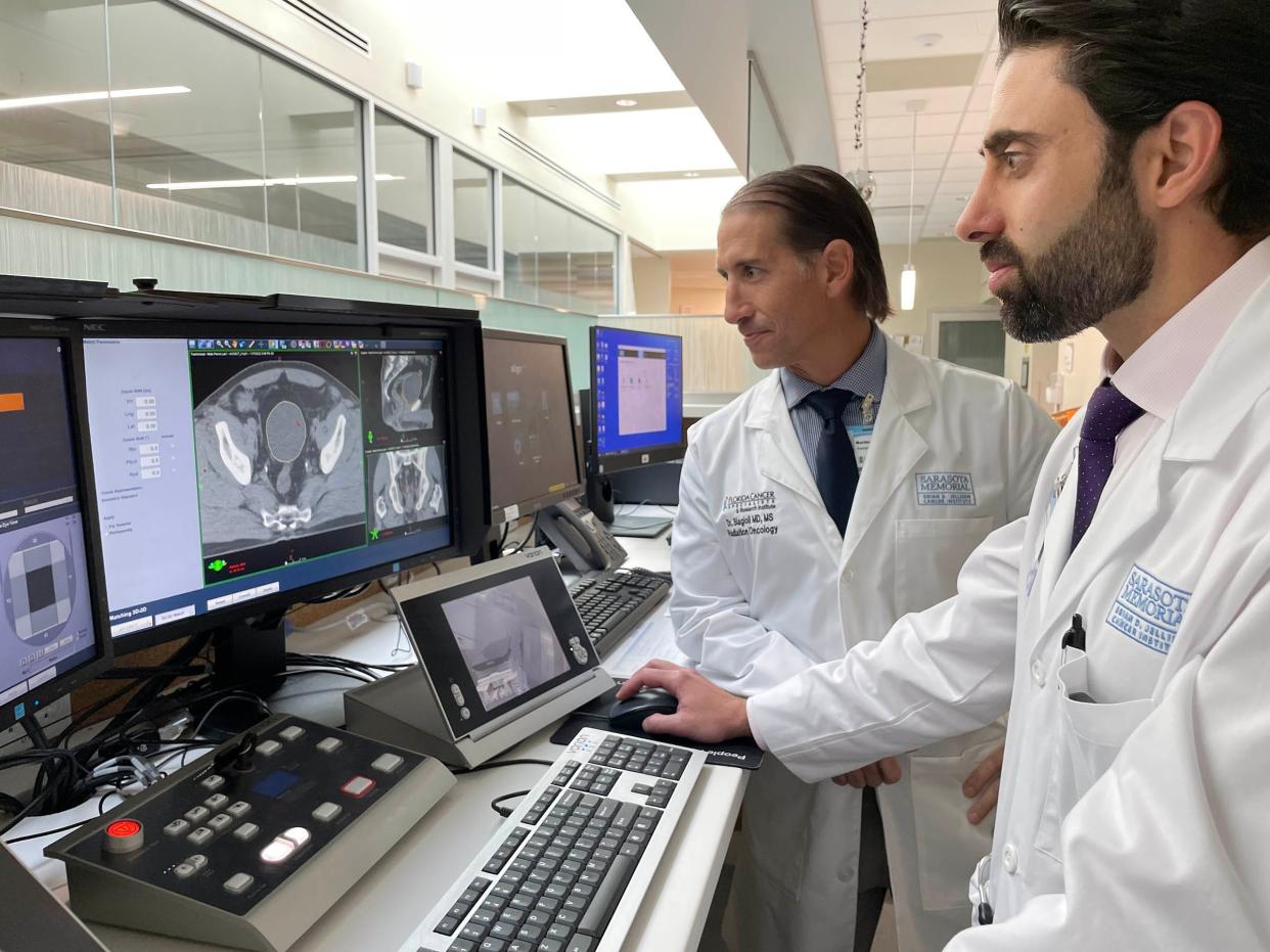 Drs. Kunal Saigal, in front, and Matthew Biagioli will administer the high-dose rate brachytherapy treatments on patients with cancer. Both doctors are fellowship trained in brachytherapy.