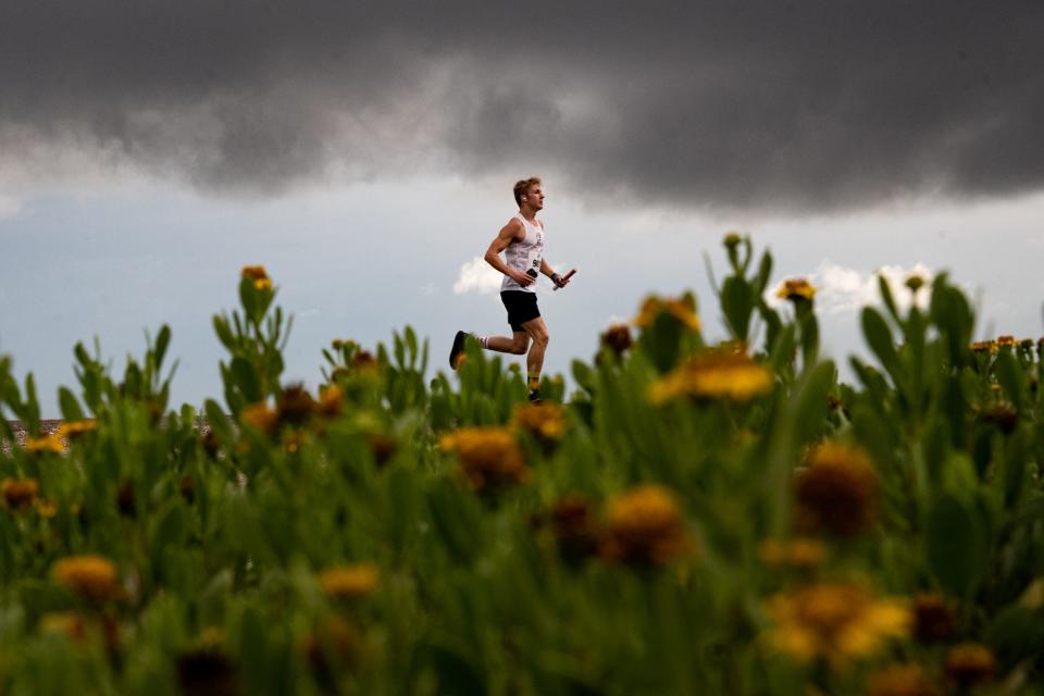 A Beach to Bay runner begins the third leg of the relay marathon at JFK Causeway on Saturday, May 20, 2023, in Corpus Christi, Texas.