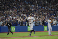 New York Yankees' Aaron Judge celebrates his 61st home run of the season, a two-run shot against the Toronto Blue Jays during the seventh inning of a baseball game Wednesday, Sept. 28, 2022, in Toronto. (Nathan Denette/The Canadian Press via AP)