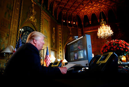 President Donald Trump speaks via video teleconference with troops from Mar-a-Lago estate in Palm Beach, Florida, November 23, 2017. REUTERS/Eric Thayer