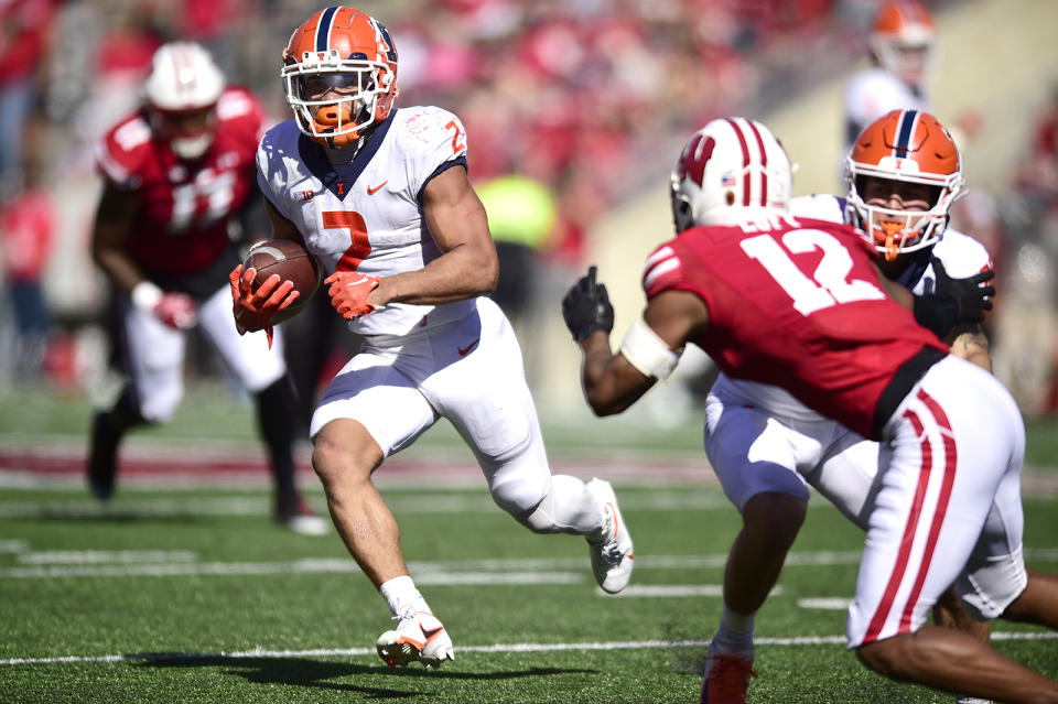 Illinois running back Chase Brown (2) runs the ball against Wisconsin during the second half of an NCAA college football game Saturday, Oct. 1, 2022, in Madison, Wis. (AP Photo/Kayla Wolf)