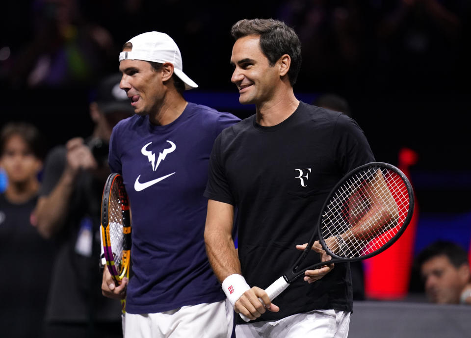 Roger Federer (pictured right) and Rafael Nadal (pictured left) share a laugh during a doubles session.