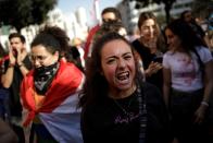 A protester shouts slogans at a demonstration organised by students during ongoing anti-government protests in Beirut