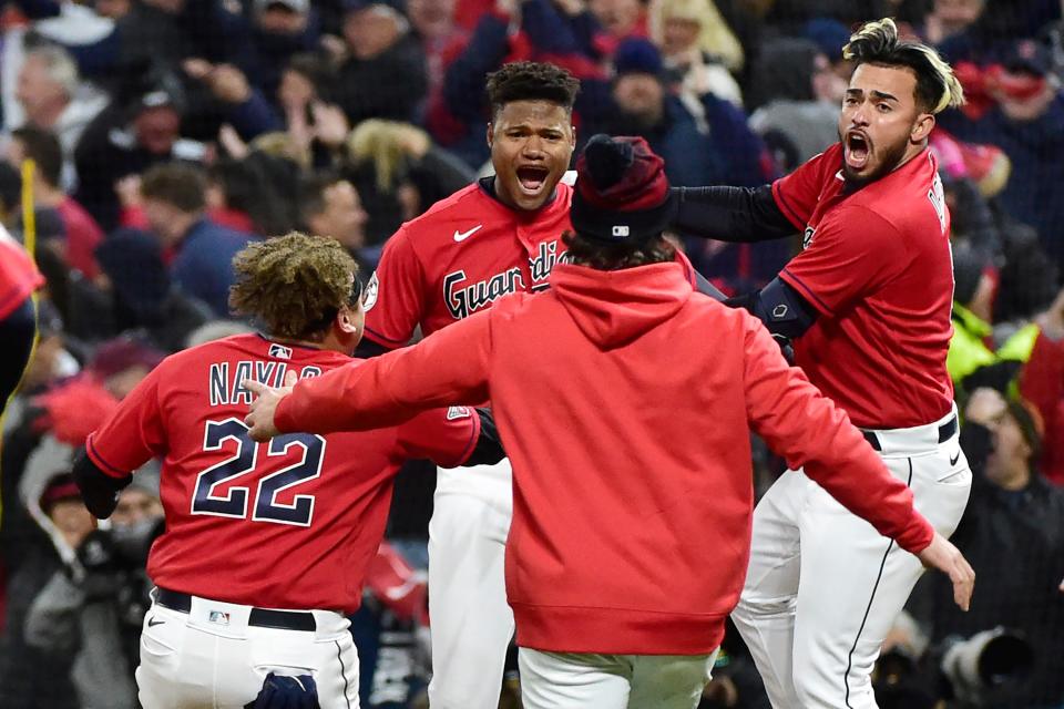 Cleveland Guardians' Oscar Gonzalez, second from left, is greeted by teammates after he drove in the winning run in the ninth inning of Game 3 of the baseball team's AL Division Series against the New York Yankees. Gonzalez is among the youthful Guardians who are giving fans a reason to be excited for years to come.