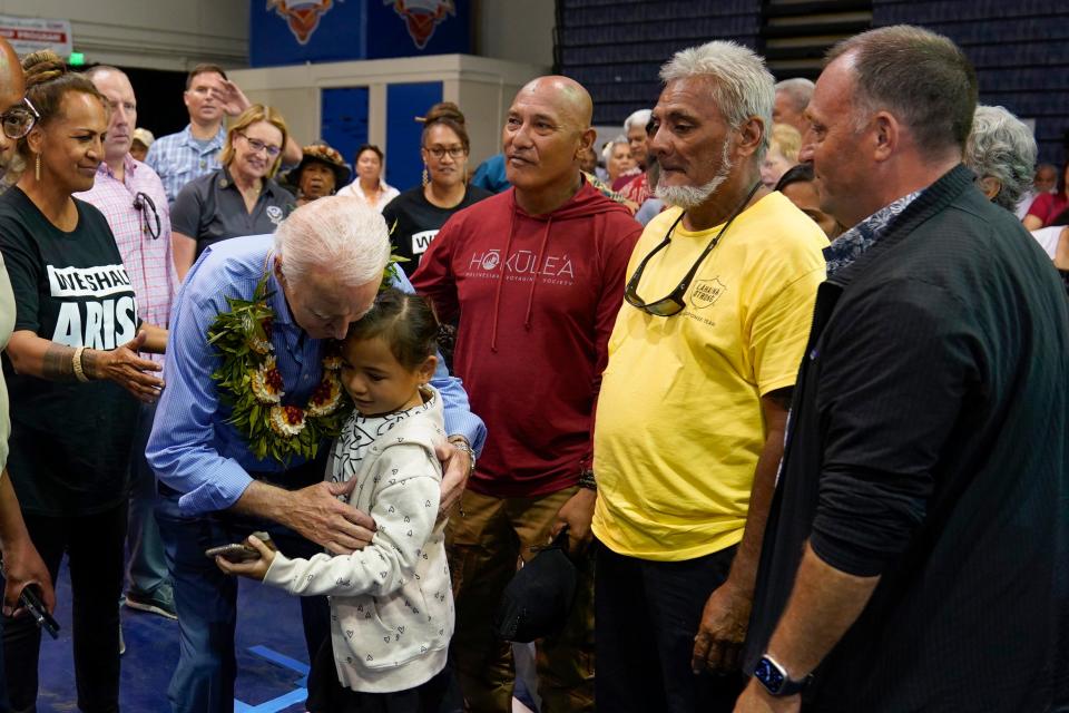 President Joe Biden hugs a child as he meets with community members impacted by the Maui wildfires at Lahaina Civic Center, (AP)
