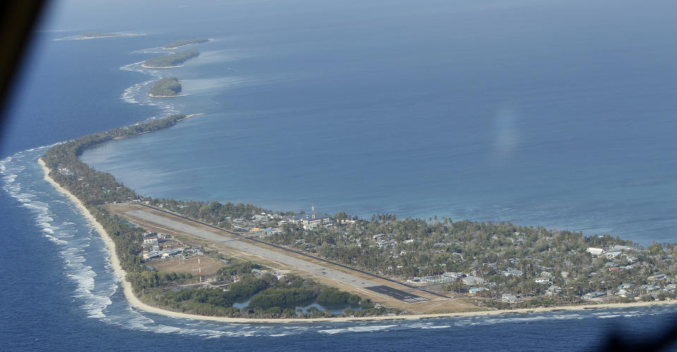 FILE - Funafuti, the main island of the nation state of Tuvalu, is photographed from a Royal New Zealand airforce C130 aircraft as it approaches the tiny South Pacific nation. On Friday, Jan 26, 2024, the small Pacific island of Tuvalu head to the polls to select representatives for its 16-seat parliament. (AP Photo/Alastair Grant, File)