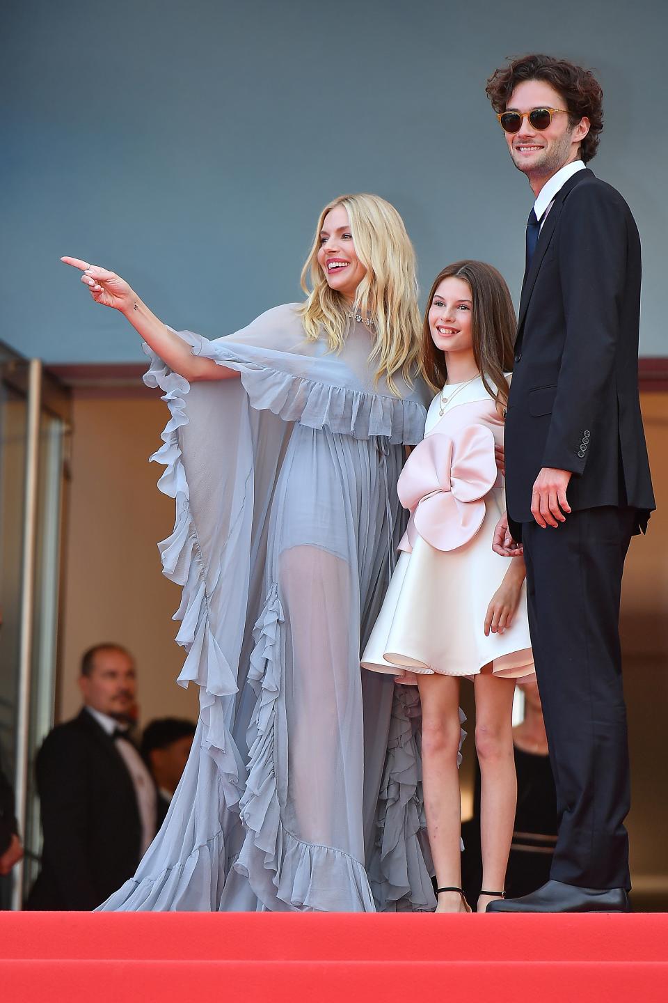 Sienna Miller, daughter Marlowe Sturridge, and boyfriend Oli Green screen Horizon: An American Saga at Cannes Film Festival on May 19.