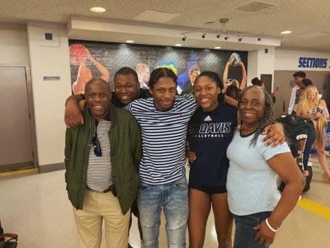 Mahalia White (center) has credited the support of her family with helping her beat cancer and a severe knee injury. From the left are her father Martin, her older brother Michael, her twin brother Matthew, White and her mother Patsy.