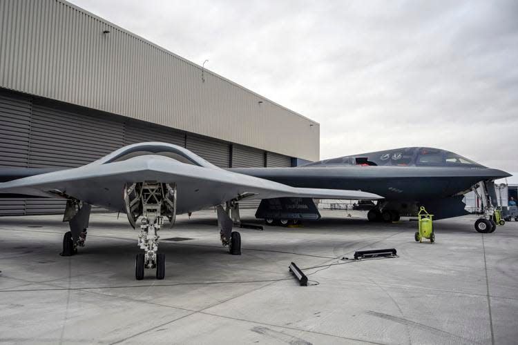 The Northrop Grumman X-47B, left, and Northrop B-2 Spirit, also known as the "Stealth Bomber," were on display during an expo ahead of the B-21 unveiling ceremony on Friday.