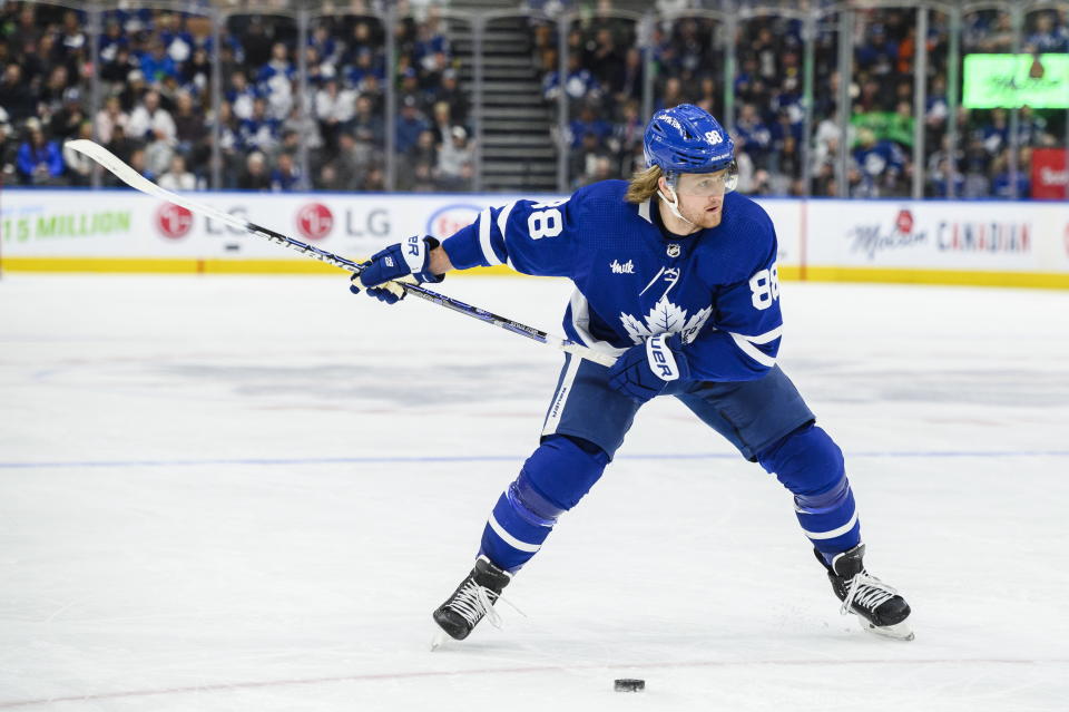 Toronto Maple Leafs right wing William Nylander (88) takes a shot against Detroit Red Wings goaltender Alex Nedeljkovic during the second period of an NHL hockey game in Toronto on Sunday, April 2, 2023. (Christopher Katsarov/The Canadian Press via AP)