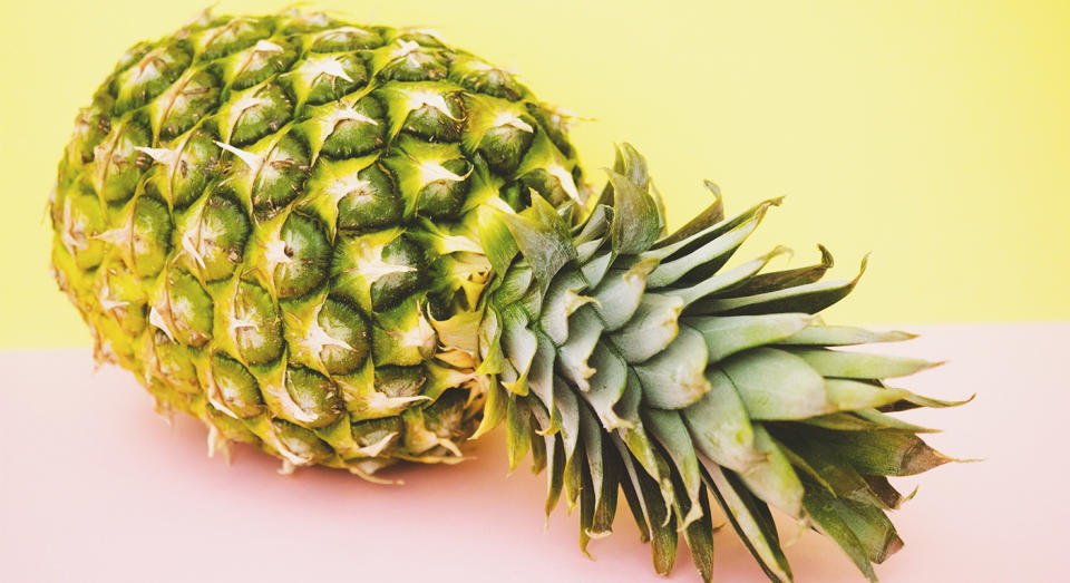 A man’s hack for eating a pineapple with his hands has gone viral. [Photo: Getty]