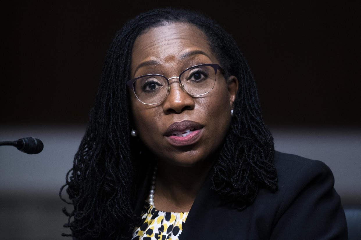 Ketanji Brown Jackson sits at a microphone during a Senate confirmation hearing.