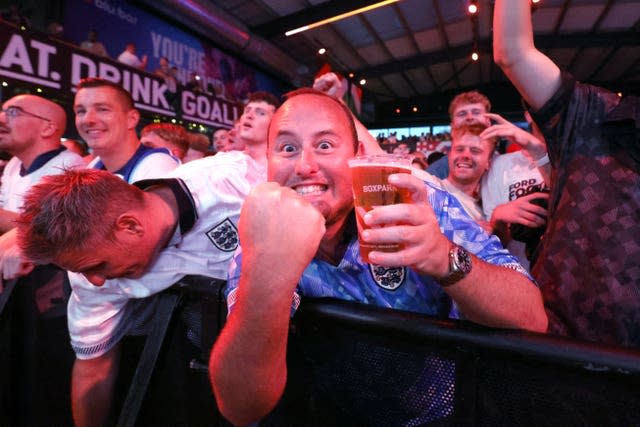 England fans celebrate at BOXPark Wembley, London, after a screening of the UEFA Euro 2024, semi final match, between England and the Netherlands