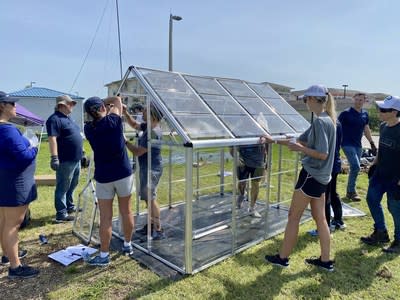 PureCycle and Millennia Gardens Elementary School in Orlando volunteer to build a greenhouse during Pure Planet Day 2022