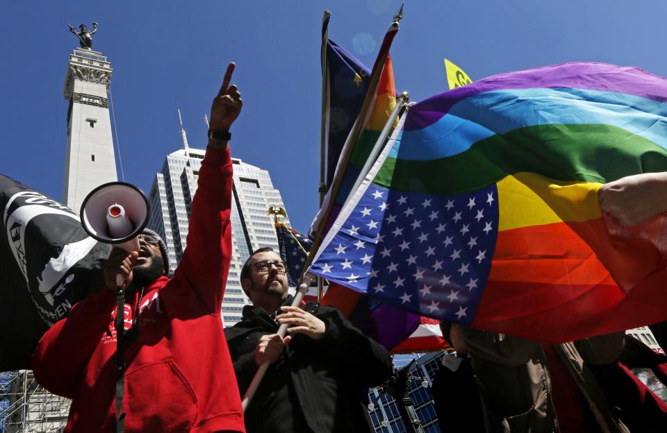 Demonstrators gather to protest a controversial religious freedom bill in Indianapolis