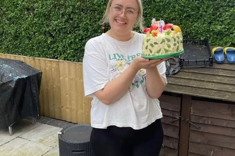 Ellie proudly showed off the impressive homemade cake for the occasion