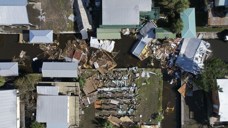 Debris from destroyed homes litters a canal in Horseshoe Beach, Fla., Thursday, Aug. 31, 2023, one day after the passage of Hurricane Idalia.