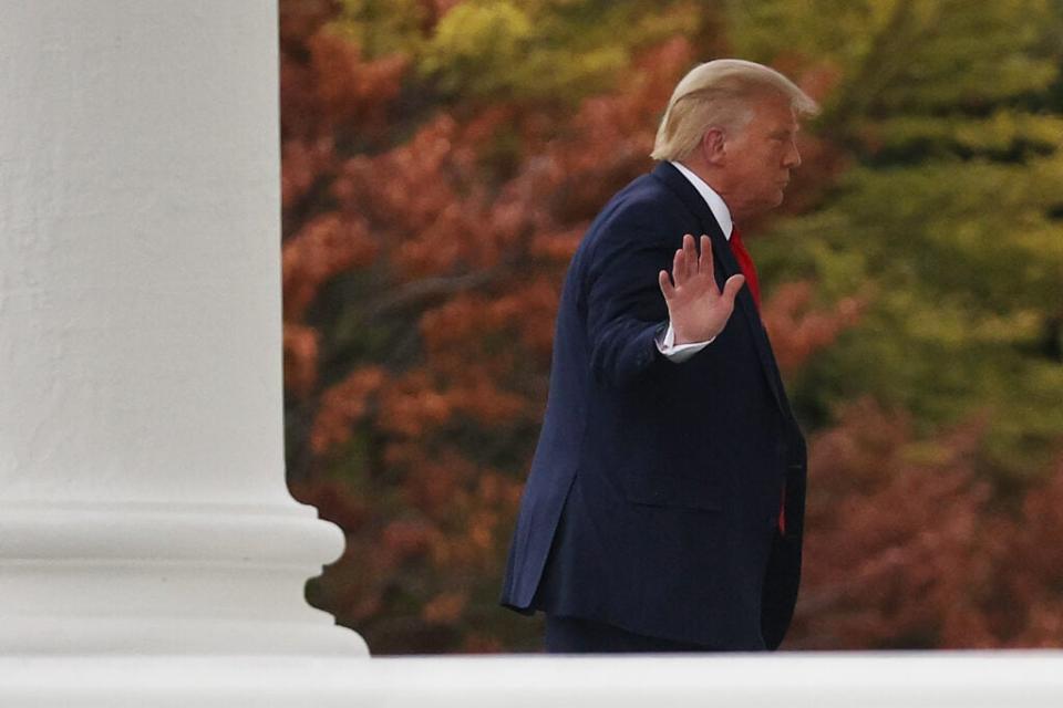 U.S. President Donald Trump waves to journalists as he returns to the White House following a trip to Wisconsin September 1, 2020 in Washington, DC. The president traveled to Kenosha, Wisconsin, to survey damage and speak to law enforcement officials following the shooting of Jacob Blake by police and the killing of two protesters by an under-age vigilante last week. (Photo by Chip Somodevilla/Getty Images)