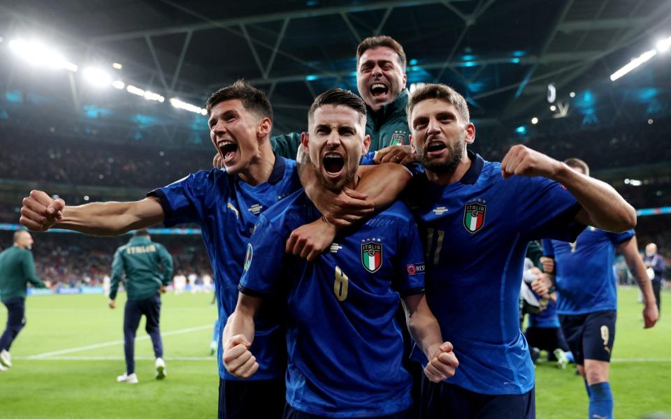 Jorginho celebrates after he scores the winning penalty during the shoot-out at Euro 2020 Semi Final Italy v Spain