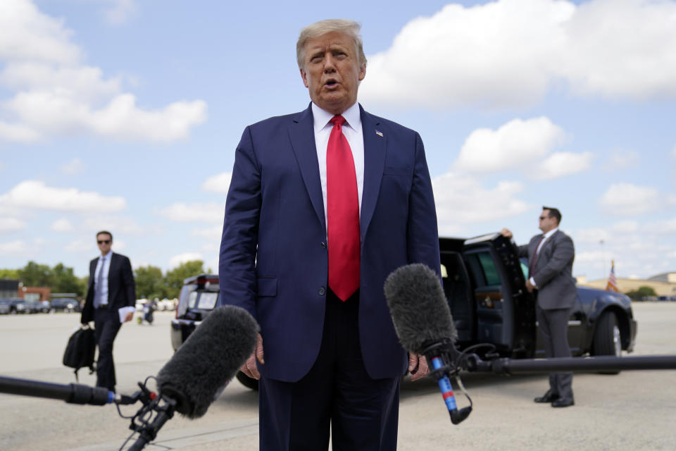 President Donald Trump speaks to reporters before boarding Air Force One for a trip to Jupiter, Fla., to speak about the environment, Tuesday, Sept. 8, 2020, at Andrews Air Force Base, Md. He will also travel to a campaign rally in North Carolina. (AP Photo/Evan Vucci)