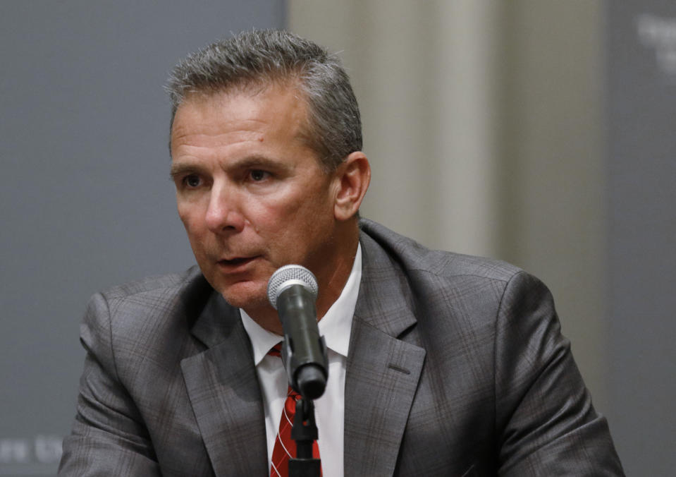 FILE - In this Aug. 22, 2018, file photo, Ohio State football coach Urban Meyer makes a statement during a news conference in Columbus, Ohio. Meyer’s current suspension and previous paid leave have restricted him from talking football with his staff and athletes during August with one exception _ a team meeting the day after the suspension was announced. Emails from the senior vice president for human resources show Meyer and athletic director Gene Smith were allowed to meet with the players and coaches last Thursday, Aug. 23, 2018. (AP Photo/Paul Vernon, File)