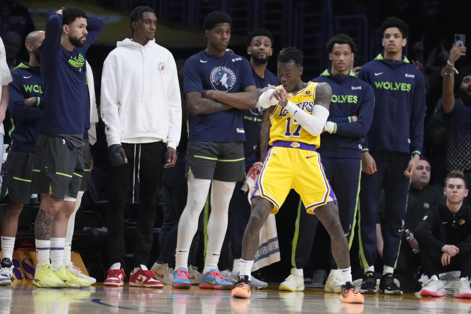 Los Angeles Lakers guard Dennis Schroder (17) celebrates in front of the Minnesota Timberwolves' bench after making a 3-point basket in the closing seconds of the fourth quarter of an NBA basketball play-in tournament game Tuesday, April 11, 2023, in Los Angeles. (AP Photo/Marcio Jose Sanchez)