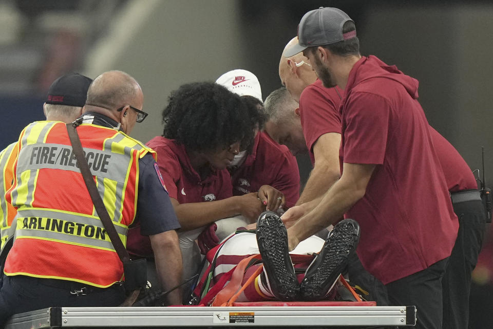 Arkansas defensive lineman John Morgan III us carted off the field after he collapsed during the second half of an NCAA college football game against Texas A&M, Saturday, Sept. 30, 2023, in Arlington, Texas. (AP Photo/LM Otero)