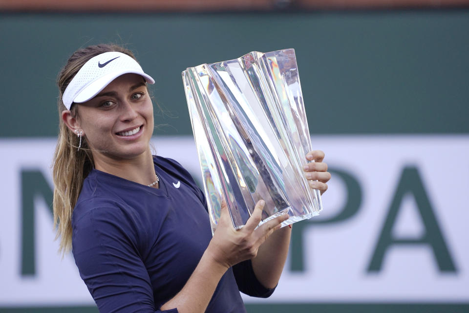 Paula Badosa, of Spain, holds up her trophy after defeating Victoria Azarenka, of Belarus, in the singles final at the BNP Paribas Open tennis tournament Sunday, Oct. 17, 2021, in Indian Wells, Calif. (AP Photo/Mark J. Terrill)