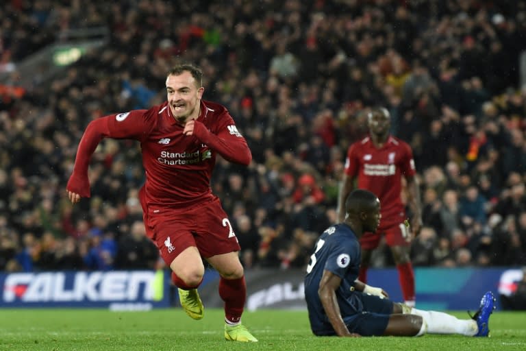 Liverpool midfielder Xherdan Shaqiri celebrates after scoring their third goal against Manchester United