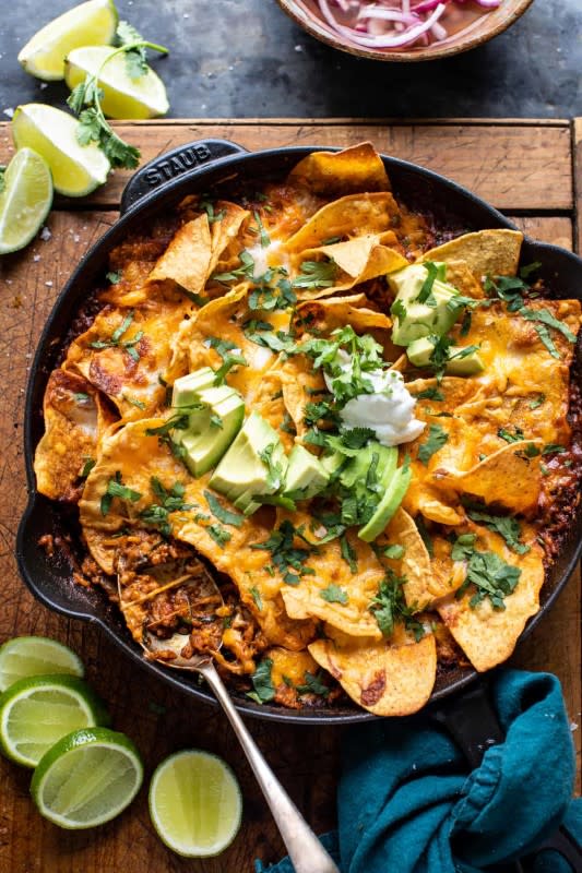 <p>Mexican seasoned chicken, rice, and enchilada sauce all cooked together in one skillet, then topped with tortilla chips and plenty of cheese.</p><p><strong>Get the recipe: <a href="https://www.halfbakedharvest.com/chicken-tortilla-enchilada-rice-bake/" rel="nofollow noopener" target="_blank" data-ylk="slk:Chicken Tortilla Enchilada Rice Bake;elm:context_link;itc:0;sec:content-canvas" class="link ">Chicken Tortilla Enchilada Rice Bake</a></strong></p><p><strong>Related: <a href="https://www.yahoo.com/lifestyle/54-heart-healthy-mexican-recipes-201503376.html" data-ylk="slk:54 Healthy Mexican Food Recipes for Dinner and Beyond;elm:context_link;itc:0;sec:content-canvas;outcm:mb_qualified_link;_E:mb_qualified_link;ct:story;" class="link  yahoo-link">54 Healthy Mexican Food Recipes for Dinner and Beyond</a></strong></p>