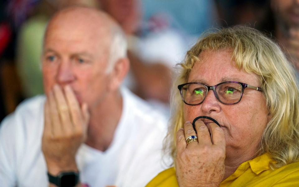 Mike and Caroline McIntyre had a nervous wait before their daughter secured gold - PA