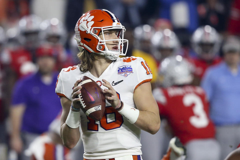 Clemson quarterback Trevor Lawrence looks for a receiver during the first half of the team's Fiesta Bowl NCAA college football playoff semifinal against Ohio State on Saturday, Dec. 28, 2019, in Glendale, Ariz.(AP Photo/Ross D. Franklin)