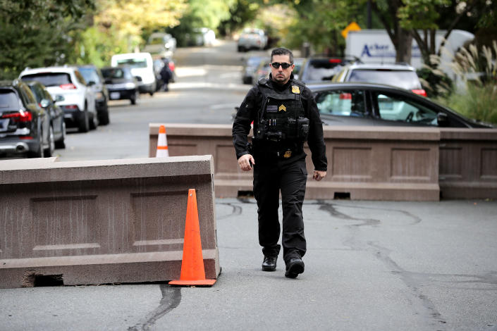 <p>U.S. Secret Service Uniform Division officers stand guard at the end of the block where former President Barack Obama and his family live and where an explosive device was sent Oct. 24, 2018 in Washington, D.C. (Photo: Chip Somodevilla/Getty Images) </p>