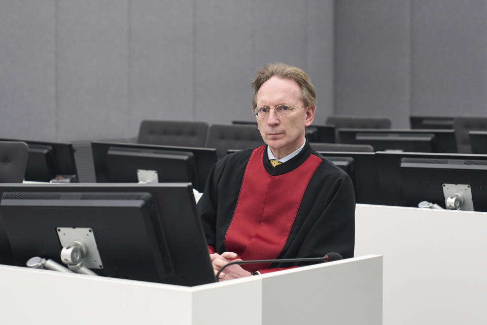 Defence Lawyer Julius von Bone sits at a special Kosovo court in The Hague, Netherlands, Thursday, Dec. 14, 2023. Appeals judges at a special Kosovo court in the Netherlands were ruling Thursday in case of a former commander in the Kosovo Liberation Army who was convicted a year ago for arbitrarily detaining and torturing prisoners and murdering one of them during a late 1990s war for Kosovo’s independence. The commander, Salih Mustafa, was convicted a year ago and sentenced to 26 years’ imprisonment for the crimes committed at a KLA compound in Zllash, Kosovo, in April 1999. He was acquitted of one charge of mistreating detainees who were perceived as supporters of Serbia. (AP Photo/Phil Nijhuis, Pool)