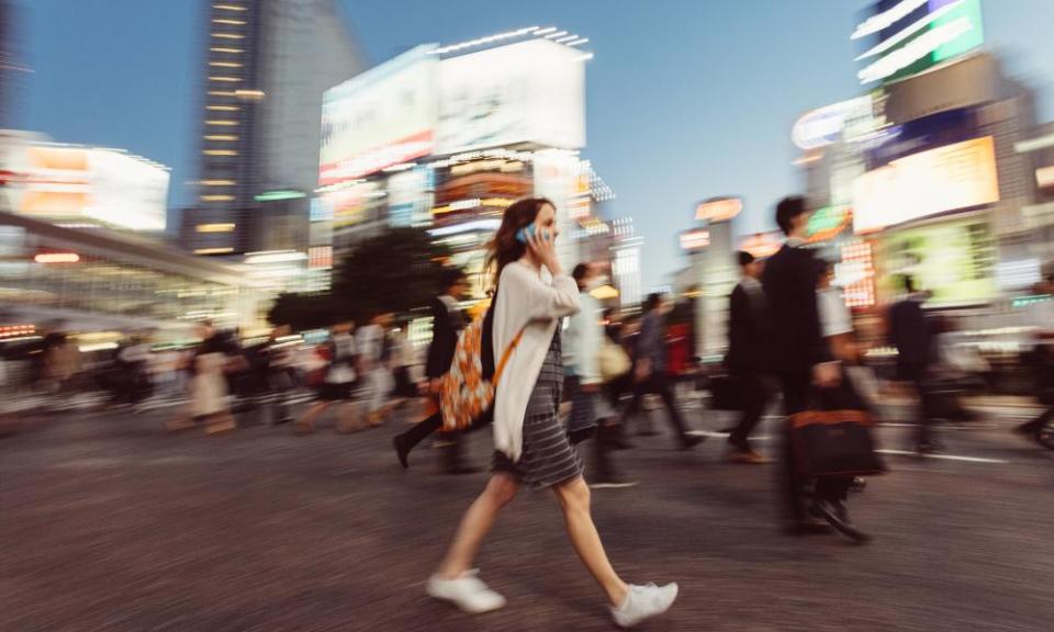 Woman on the phone at Shibuya crossing