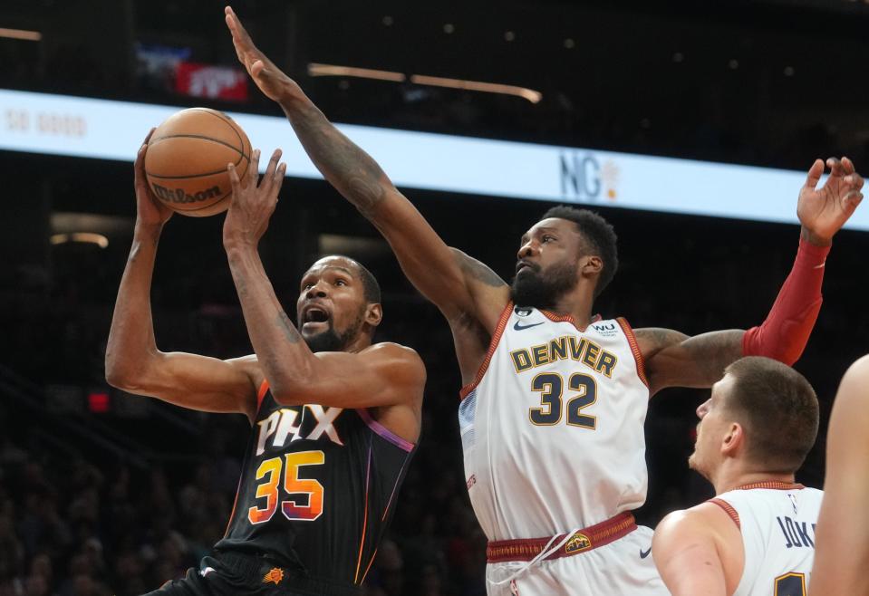 May 5, 2023; Phoenix, AZ, USA; Phoenix Suns forward Kevin Durant (35) shoots the ball over Denver Nuggets forward Jeff Green (32) during Game 3 of the Western Conference Semifinals at the Footprint Center. 