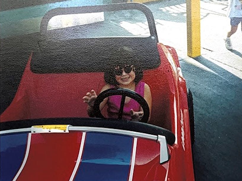 megan riding tomorrowland speedway at disney world as a kid 30 years ago