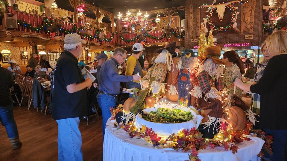 Patrons line up for the Big Texan's  sold-out Thanksgiving meal Thursday in East Amarillo.