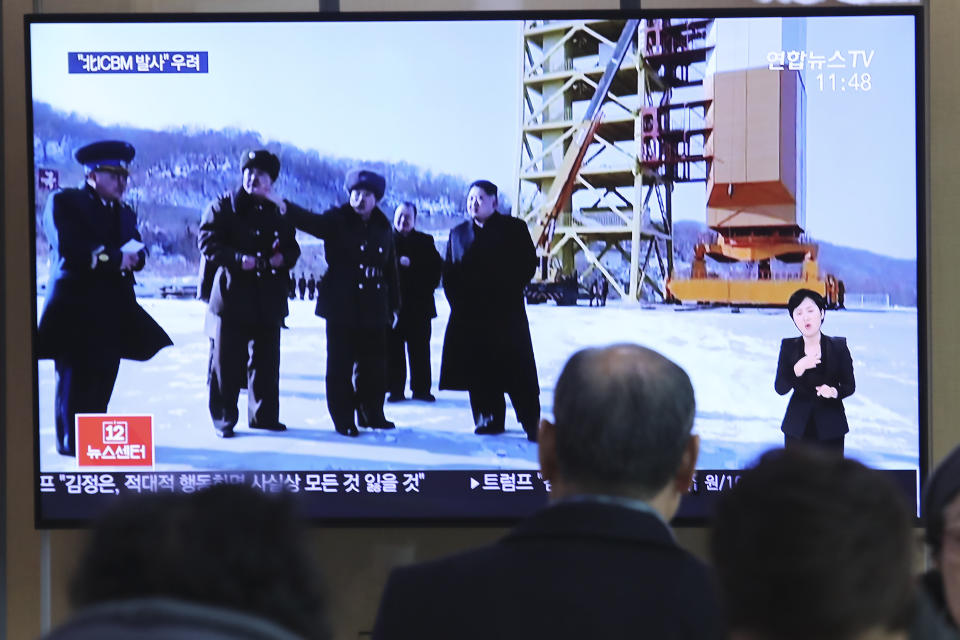 A man watches a TV screen showing a file image of the North Korean leader Kim Jong Un at his county long-range rocket launch site during a news program at the Seoul Railway Station in Seoul, South Korea, Monday, Dec. 9, 2019. North Korea said Sunday it carried out a "very important test" at its long-range rocket launch site that it reportedly rebuilt after having partially dismantled it after entering denuclearization talks with the United States last year.(AP Photo/Ahn Young-joon)