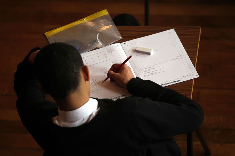 A student sitting a GCSE maths exam