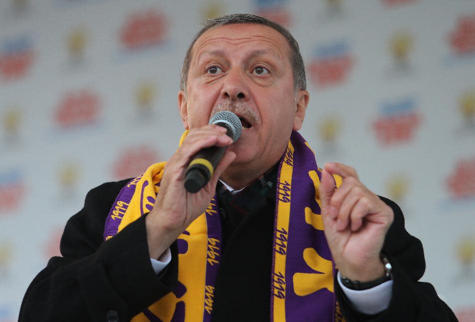 Turkish Prime Minister Recep Tayyip Erdogan addresses his supporters in Istanbul, Turkey, Saturday, March 29, 2014. Erdogan has been ensnared in a corruption scandal that has toppled four Cabinet ministers. But as Turks prepare to vote in local elections Sunday, Erdogan remains at the center of the political scene. (AP Photo)