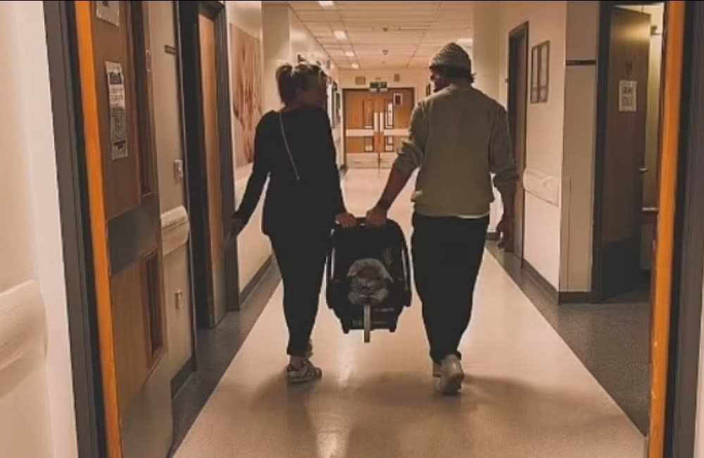 Carley Stenson and Danny Mac leave hospital with their baby credit:Bang Showbiz